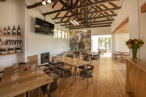 tasting room wooden tables and chairs in the tasting room with view of ceiling beams