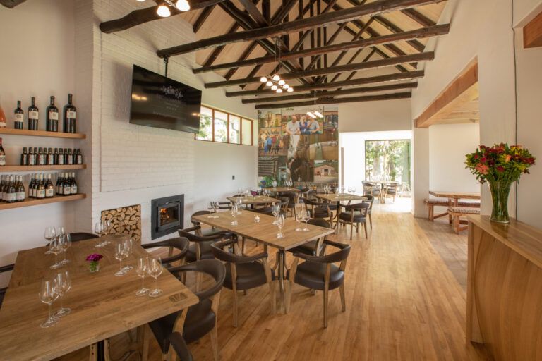 tasting room wooden tables and chairs in the tasting room with view of ceiling beams
