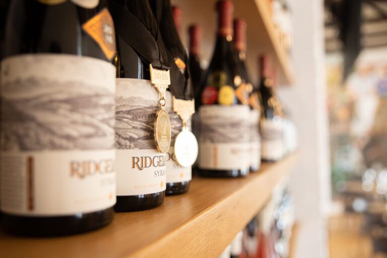 ridgelands wine bottles on a shelf in tasting room