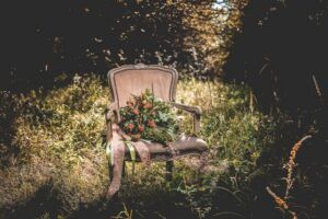 chair with flowers in a forest