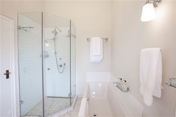 experiences at Elgin Vintners illustrated by Denniston Luxury Suite accommodation view of bath and shower