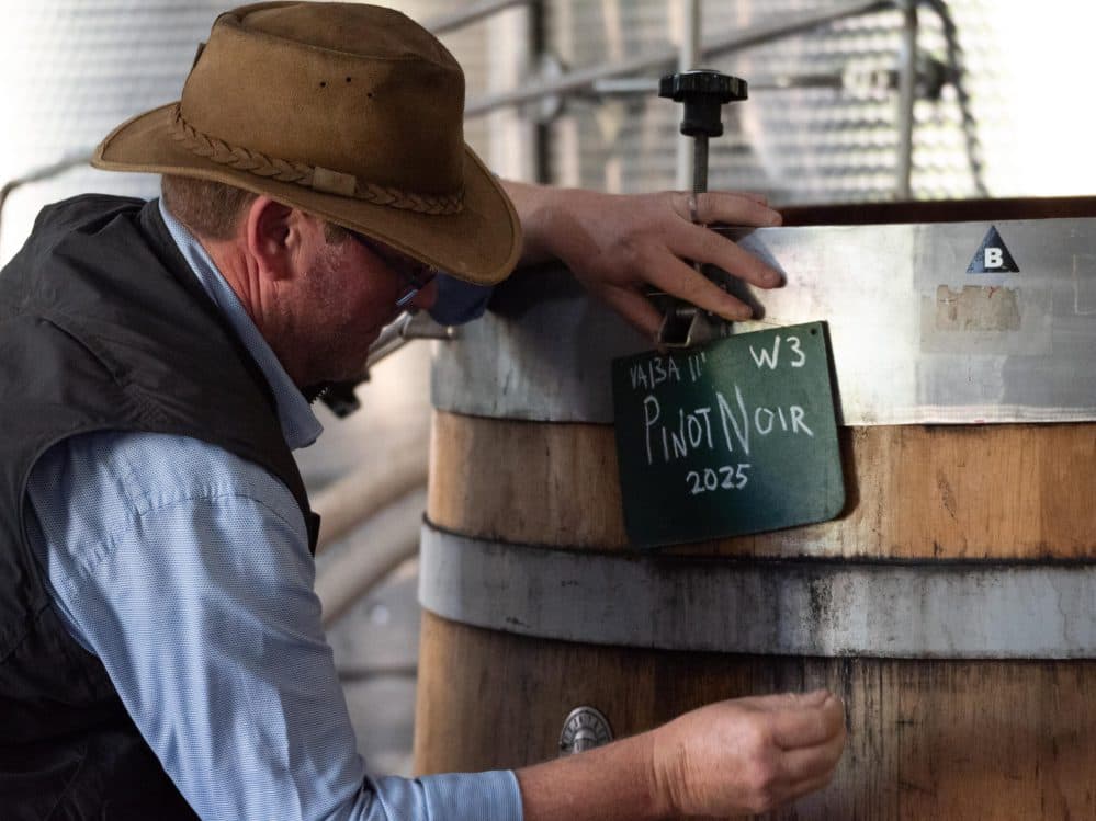 EV Harvest 2025 (250 of 304) gus dale next to barrel