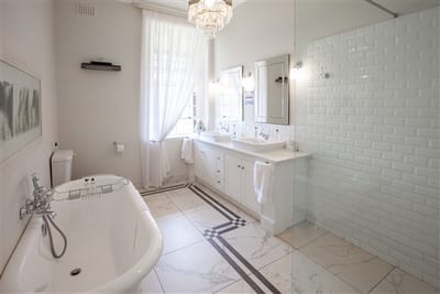 Syfret Honeymoon Suite accommodation en suite bath and cabinet to window