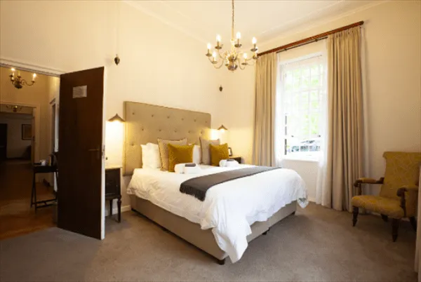 experiences at Elgin Vintners illustrated by Hahn Family Suite bedroom view from room corner to bed and door