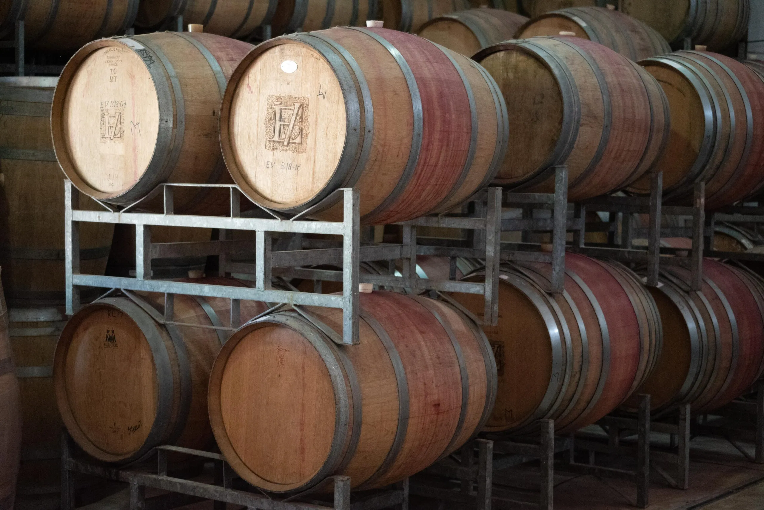 Elgin Vintners wine barrels stacked on iron bars from a distance