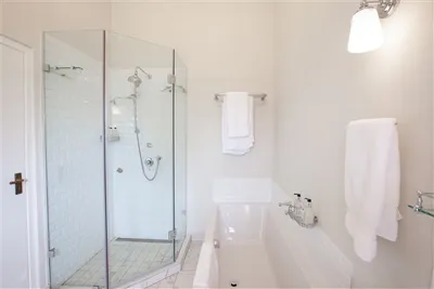 experiences at Elgin Vintners illustrated by Denniston Luxury Suite accommodation view of bath and shower